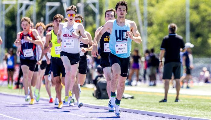 Athlete running with blue and red background